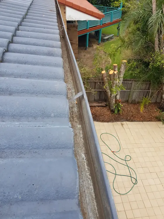 Freshly cleaned gutter on a tiled Gold Coast roof